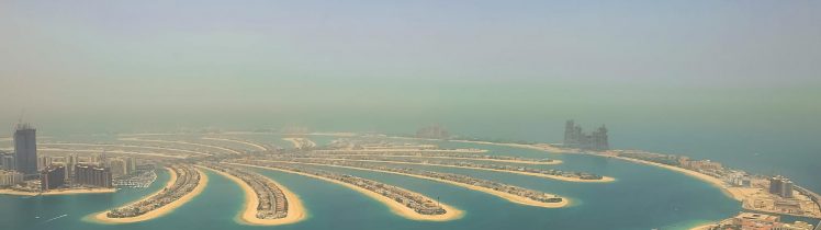 Panorama Palm Jumeirah w Dubaju z lotu ptaka – sztuczna wyspa, luksusowa zabudowa i widok na Zatokę Perską.